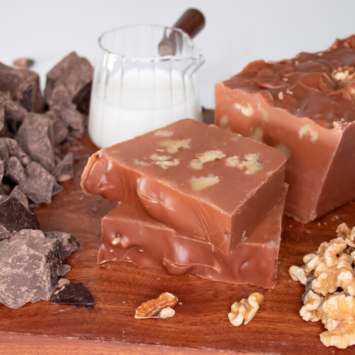 Chocolate Walnut Fudge: Our Chocolate Walnut Fudge starts with our classic Belgian chocolate fudge, blended with handfuls of crunchy walnuts throughout. Each bite delivers a smooth chocolate base paired with satisfying nutty texture for a well-balanced treat. Once you try this combo, you'll be going nuts over it! 