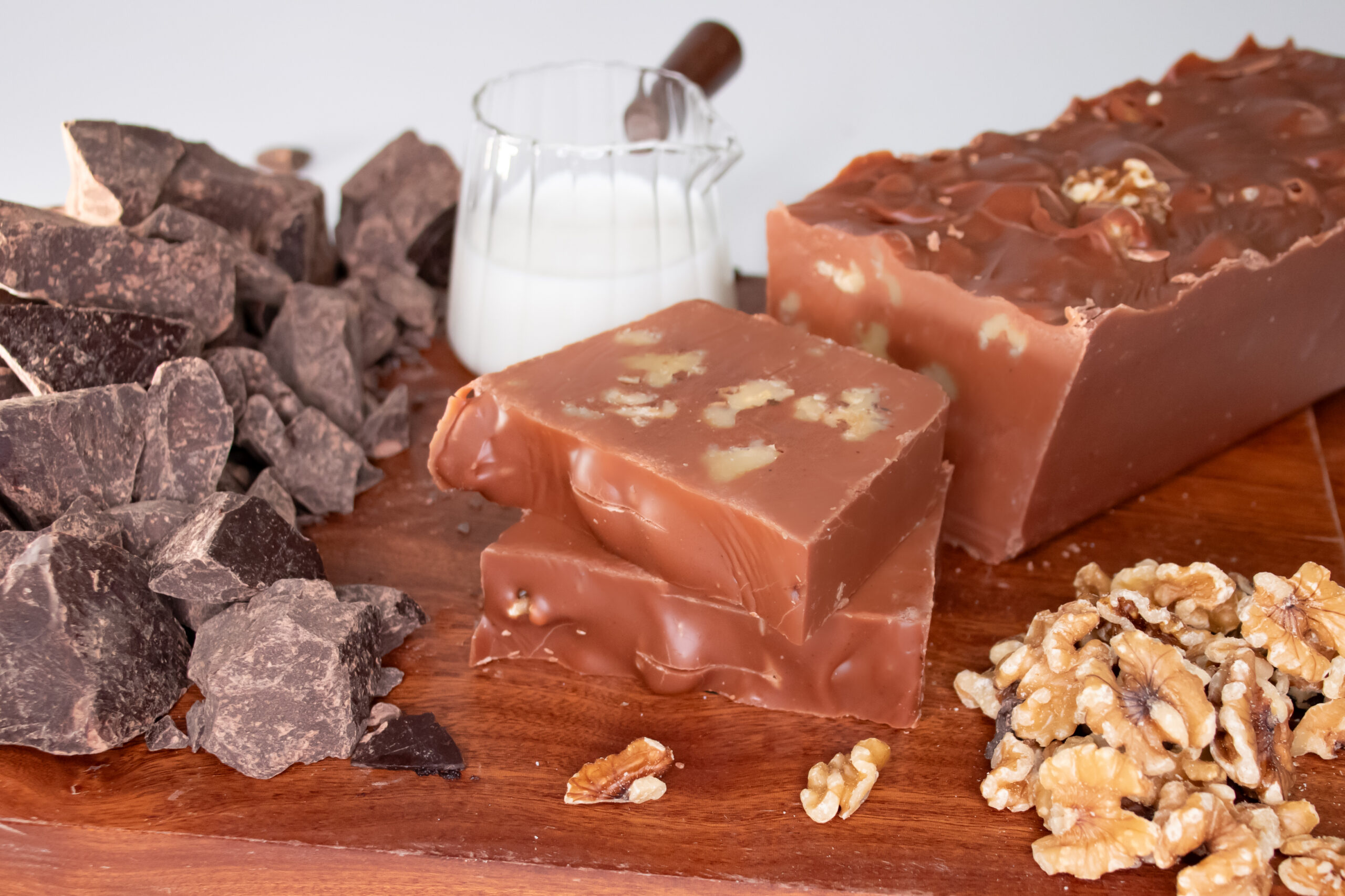 Chocolate Walnut Fudge: Our Chocolate Walnut Fudge starts with our classic Belgian chocolate fudge, blended with handfuls of crunchy walnuts throughout. Each bite delivers a smooth chocolate base paired with satisfying nutty texture for a well-balanced treat. Once you try this combo, you'll be going nuts over it!