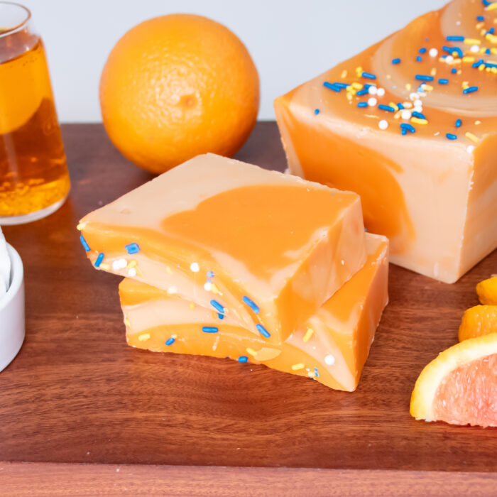 Orange Creamsicle Fudge: A timeless favorite for all ages! Our Orange Creamsicle Fudge blends tangy orange with smooth, sweet vanilla cream in a beautifully marbled display. Refreshing and creamy, every bite delivers a burst of sunshine and a touch of summer vacation!