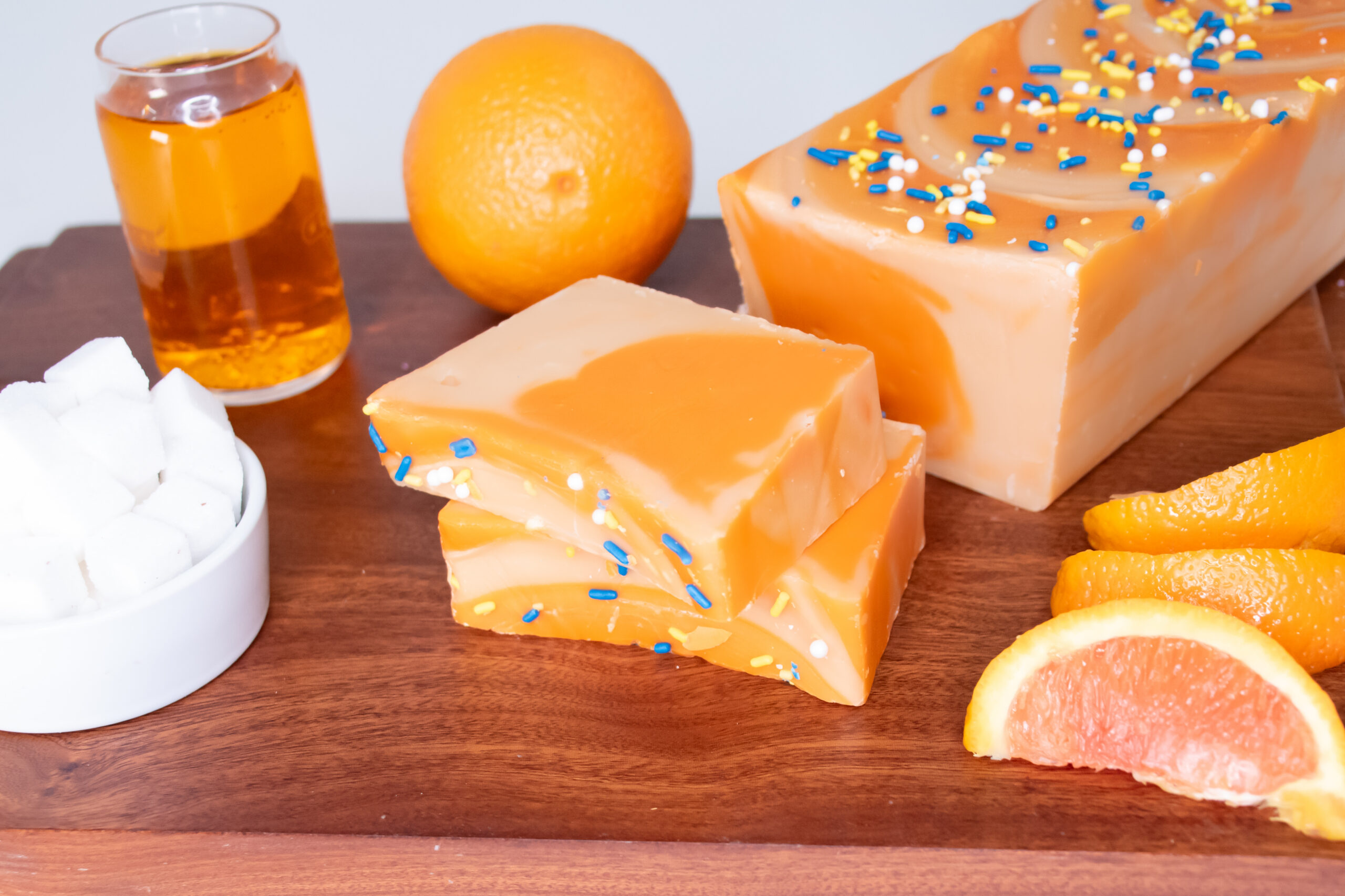 Orange Creamsicle Fudge: A timeless favorite for all ages! Our Orange Creamsicle Fudge blends tangy orange with smooth, sweet vanilla cream in a beautifully marbled display. Refreshing and creamy, every bite delivers a burst of sunshine and a touch of summer vacation!